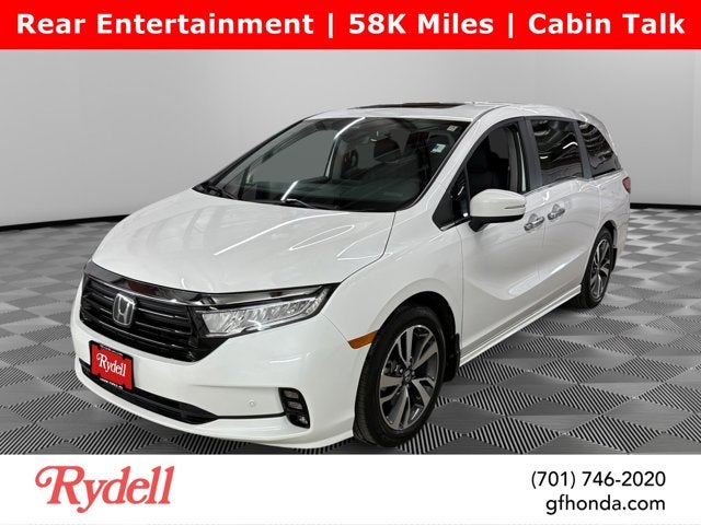 2024 Honda Odyssey Touring in Platinum White Pearl — front three-quarter view