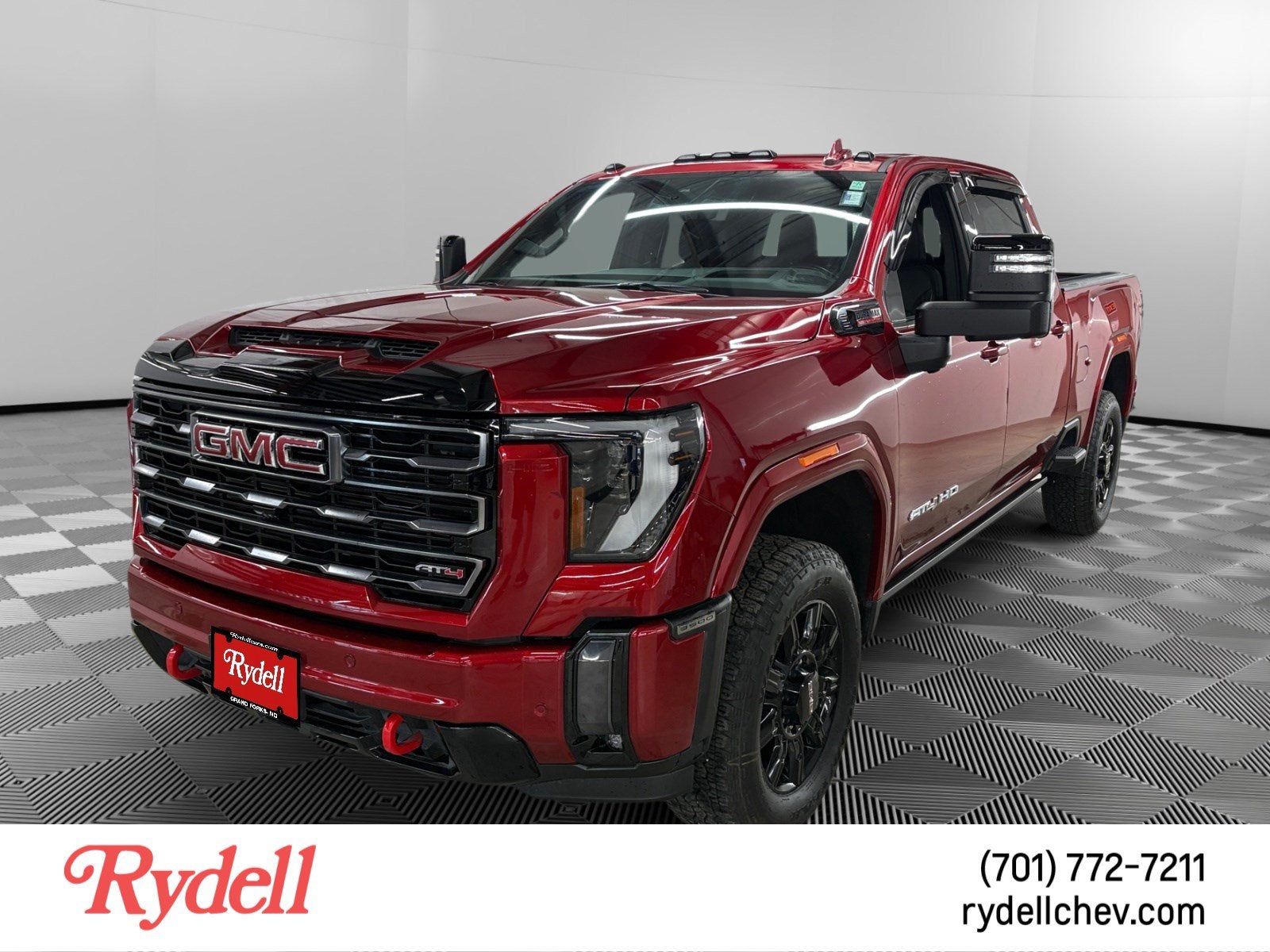 2024 GMC Sierra 3500 HD AT4 in Volcanic Red Tintcoat — front three-quarter view