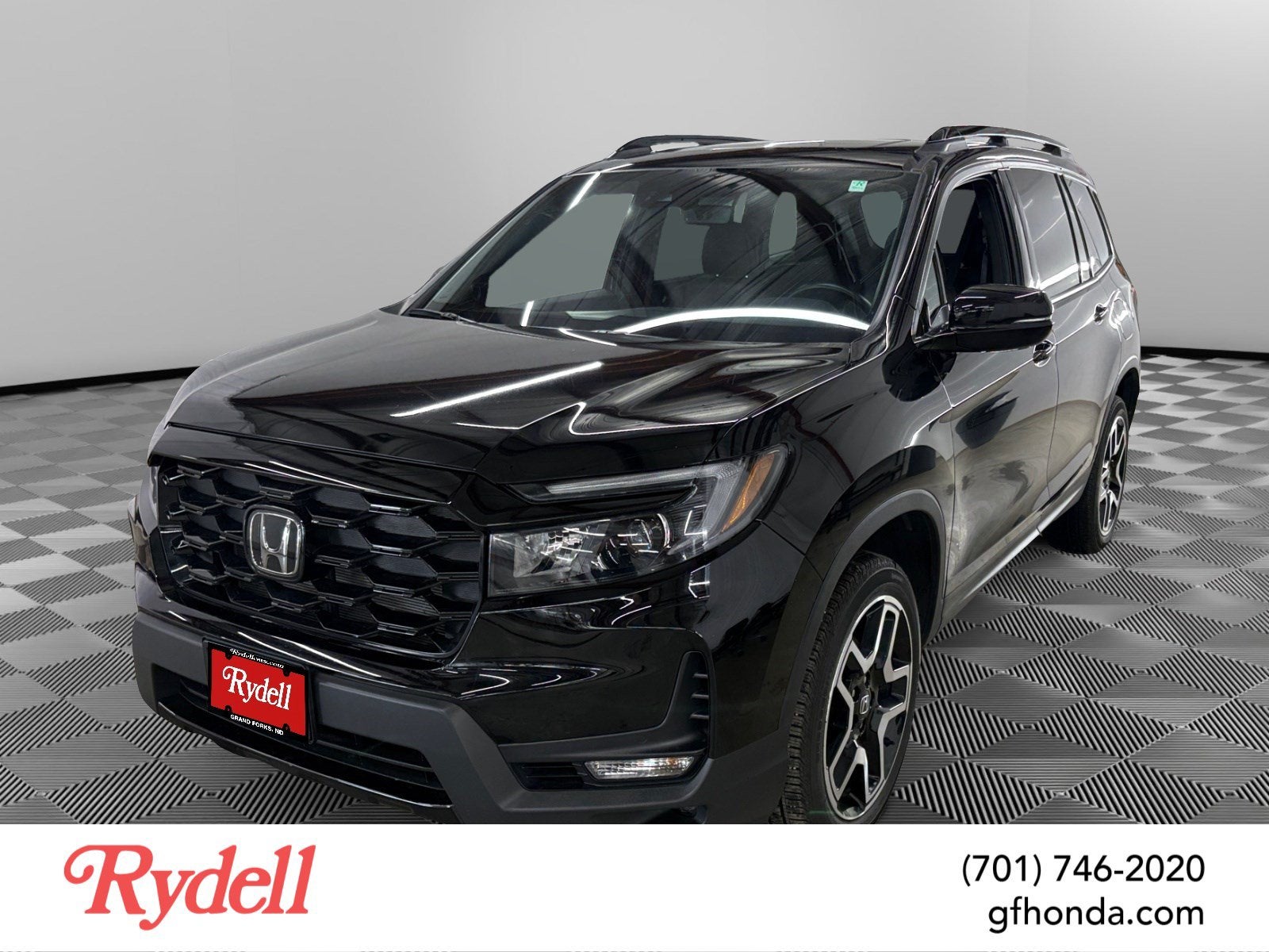 2023 Honda Passport AWD Elite in Black — front three-quarter view